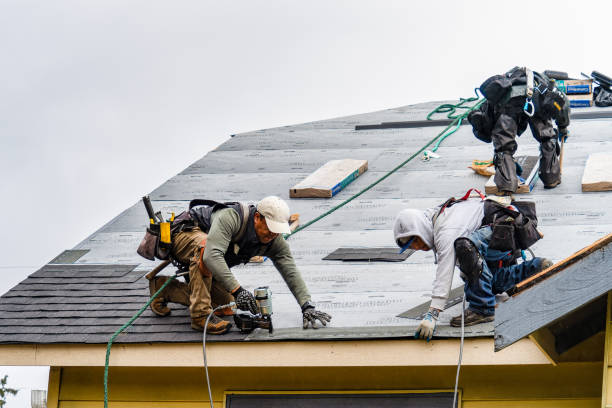 Professional Gutter Installation technician working in Rich Hill, MO